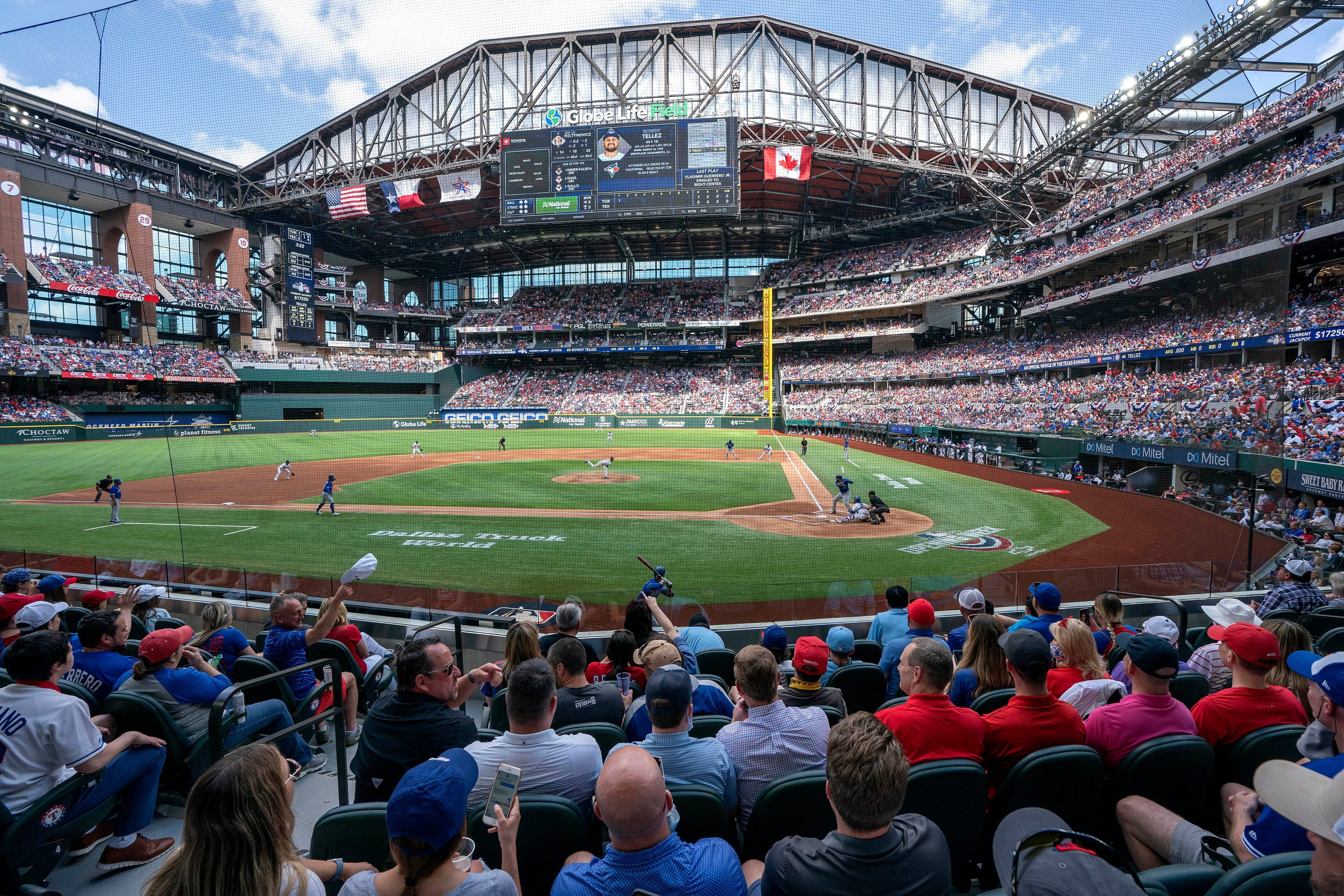 Fans fill the stands at Globe Life Field during the first inning of a baseball game between the Texas Rangers and the Toronto Blue Jays, Monday, April 5, 2021, in Arlington, Texas. The Rangers are set to have the closest thing to a full stadium in pro sports since the coronavirus shutdown more than a year ago. (Jeffrey McWhorter/AP/CP)