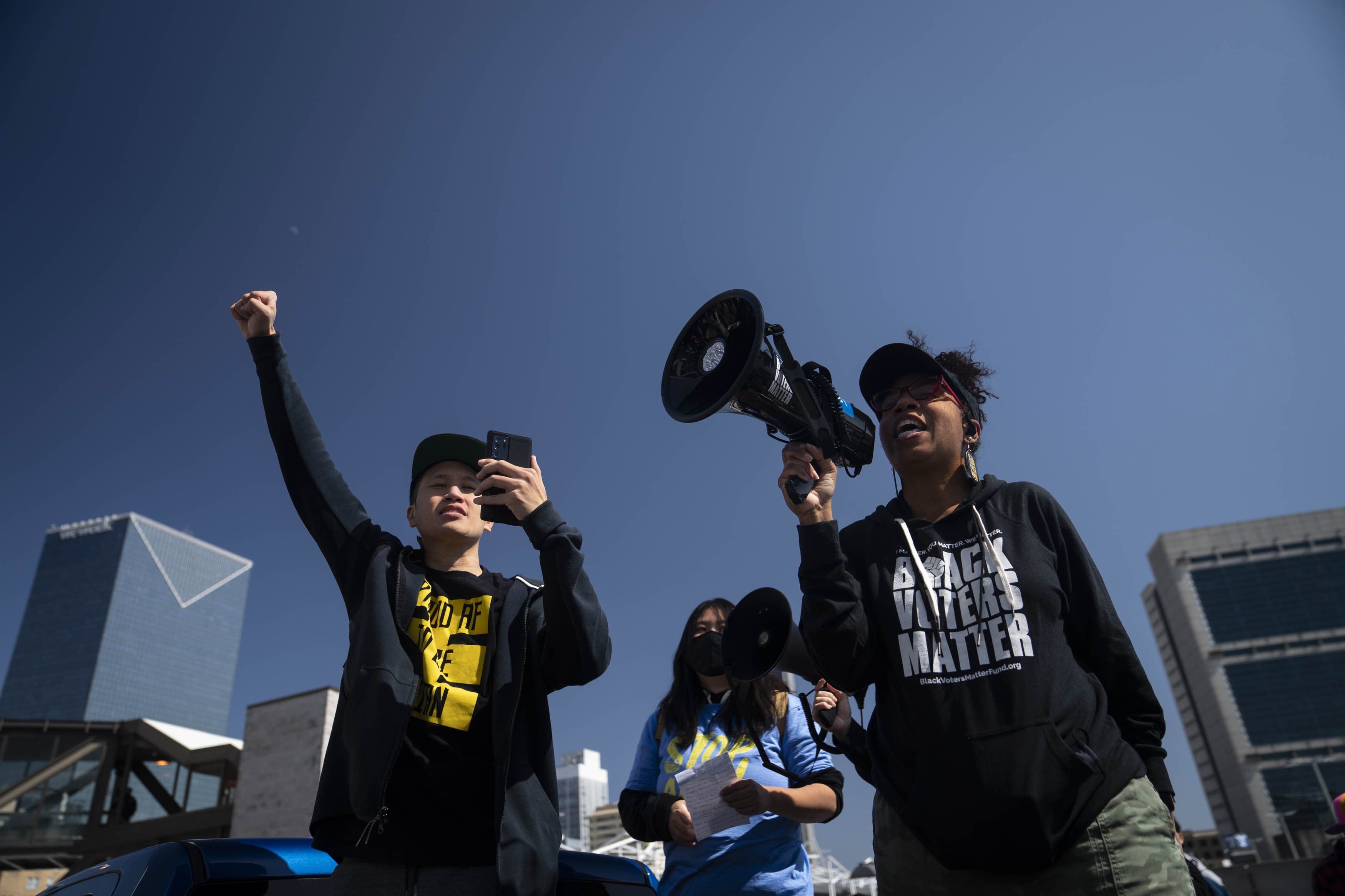 Activist William Lex Ham, left, and Wanda Mosley, Senior Coordinator in Georgia at Black Voters Matter, speak at a Stop AAPI Hate Rally in Atlanta, Georgia, U.S., on Saturday, March 20, 2021. Stop AAPI Hate, a group that tracks anti-Asian violence, said it had received nearly 3,800 reports of hate incidents since mid March, 2020, around the time that the Covid-19 pandemic seized the U.S. More than 500 of those came in the first two months of 2021. (Nicole Craine/Bloomberg/Getty Images)