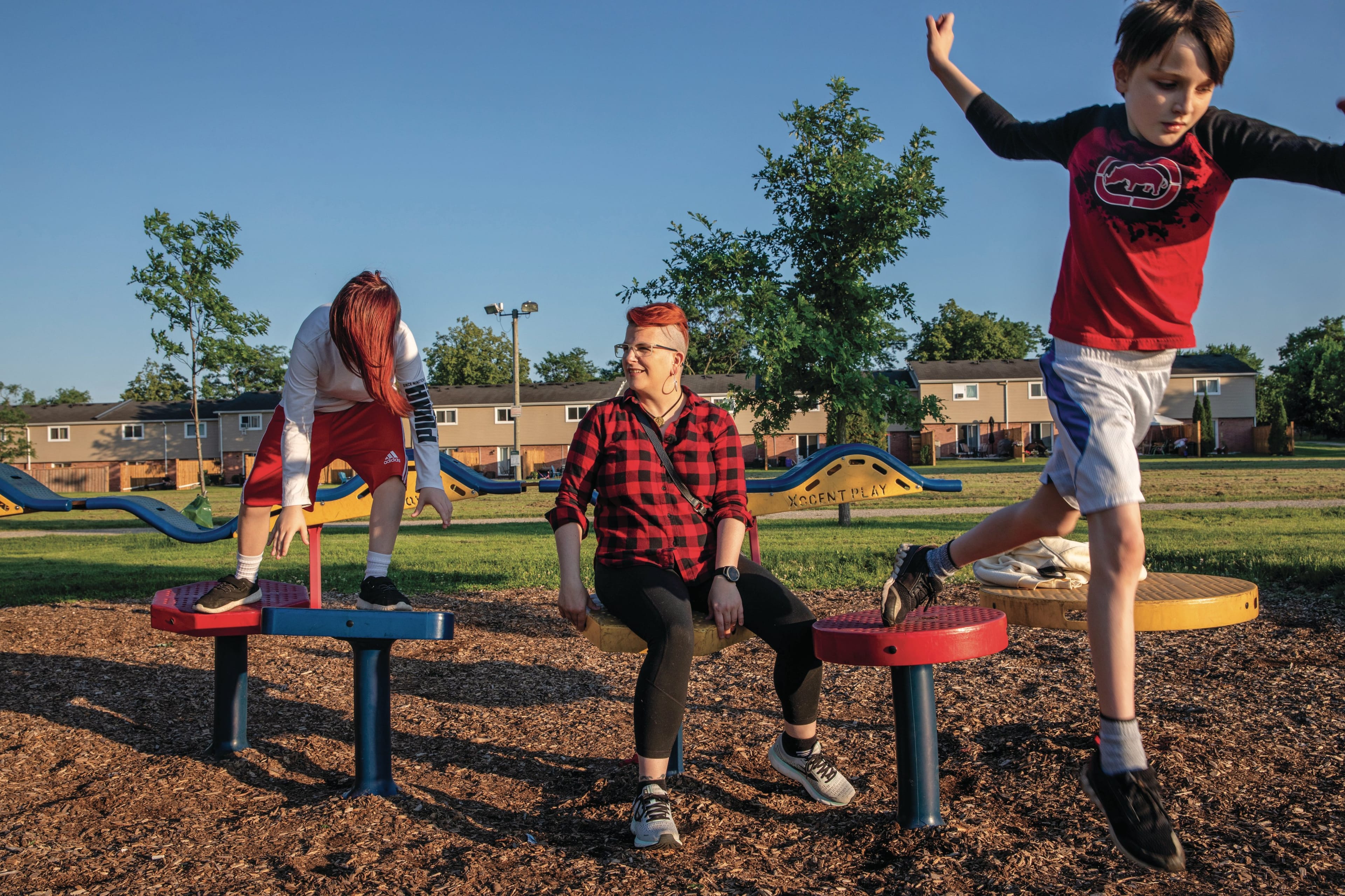 DesRosiers (centre) and their children, Aiden (left), 13, and Easton, 11, in Kitchener, Ont. (Photograph by Brett Gundlock)