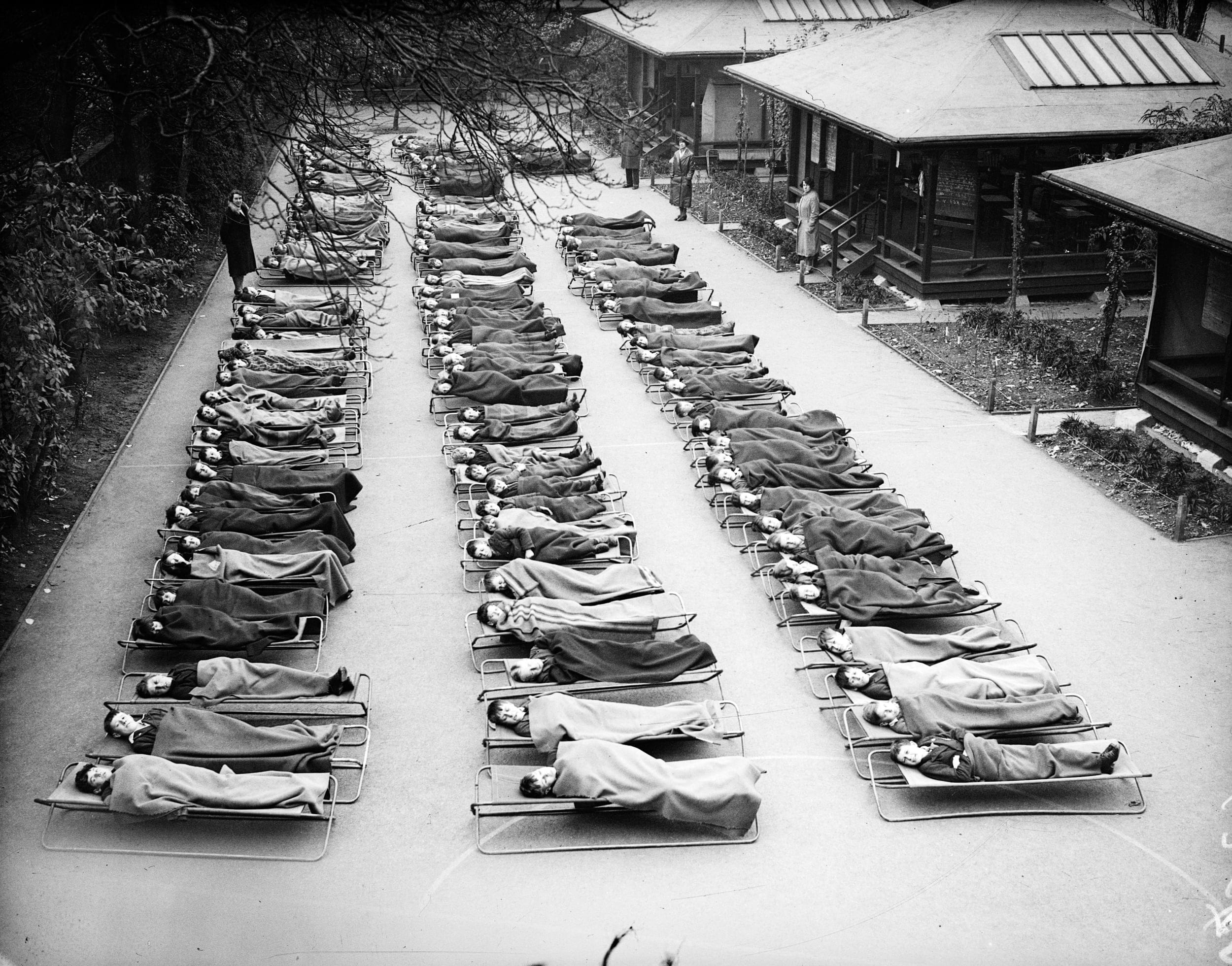 Children suffering from tuberculosis sleep outside at London hospital in November 1932 (Fox Photos/Getty Images)