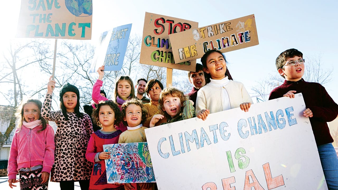 Children holding climate change signs