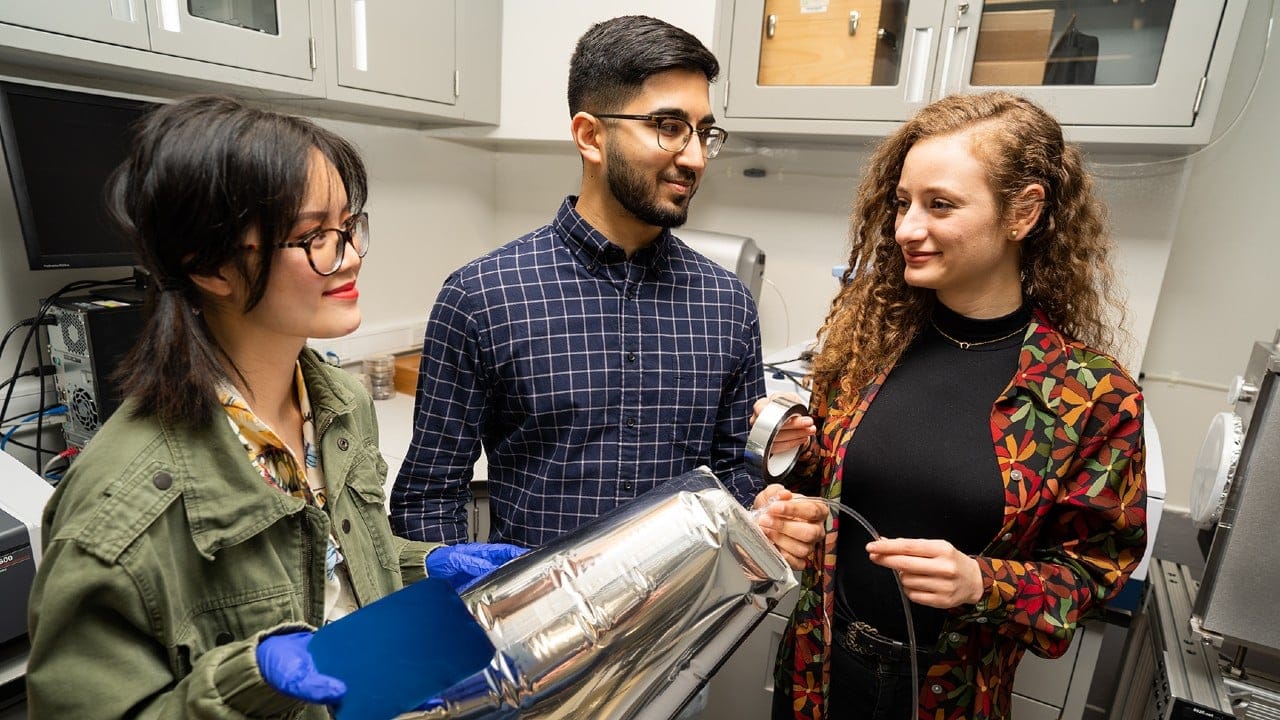Three students in a lab