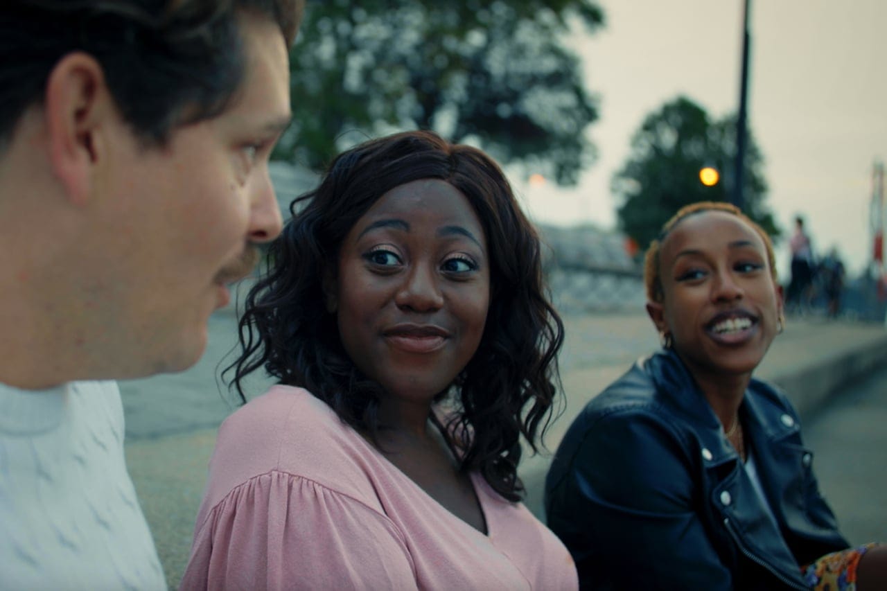 Muluba with her friends Ryan (L) and Selam (R).