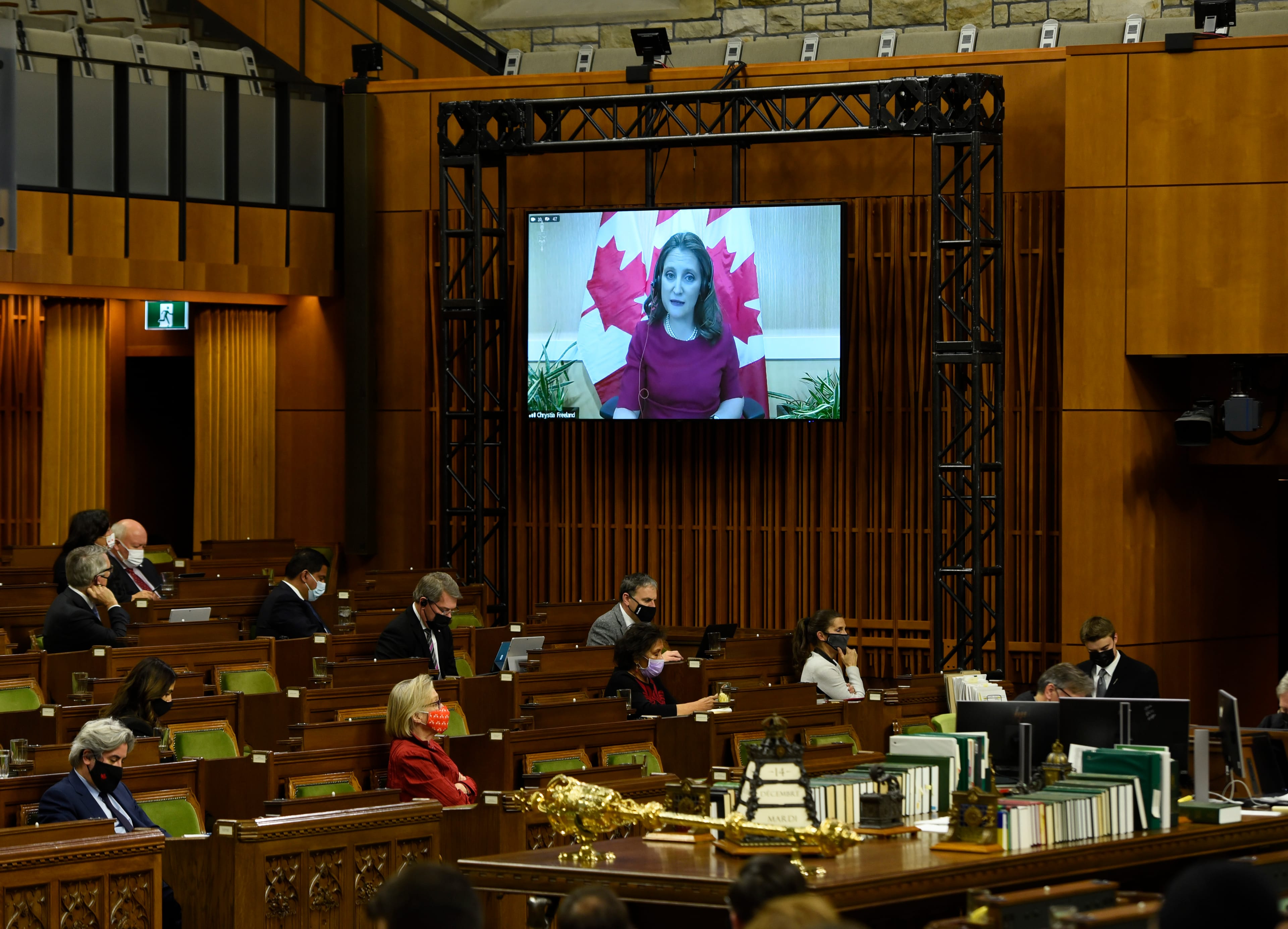 Freeland is seen via videoconference as she presents a fiscal update in the House of Commons on Parliament Hill in Ottawa, Dec. 14, 2021. (Justin Tang/The Canadian Press)
