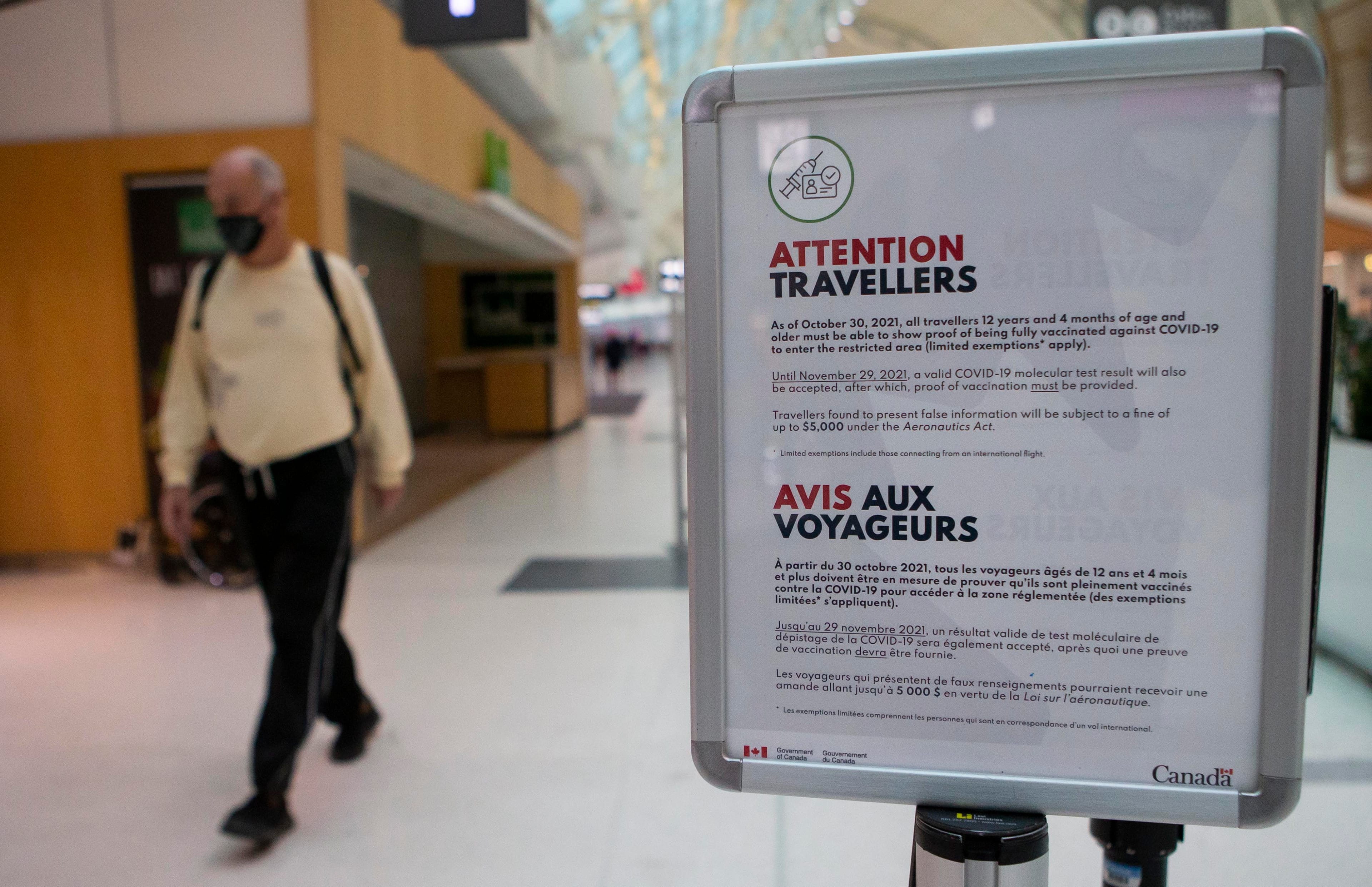 MISSISSAUGA (CANADA), Oct. 30, 2021  A mandatory vaccination sign for travelers is seen at Toronto Pearson International Airport in Mississauga, Ontario, Canada, on Oct. 30, 2021. Beginning Saturday, travelers who are 12 years of age or older need to provide proof that they have been fully vaccinated against COVID-19 while taking their trips within Canada or overseas. (Credit Image: © Zou Zheng/Xinhua via ZUMA Press)