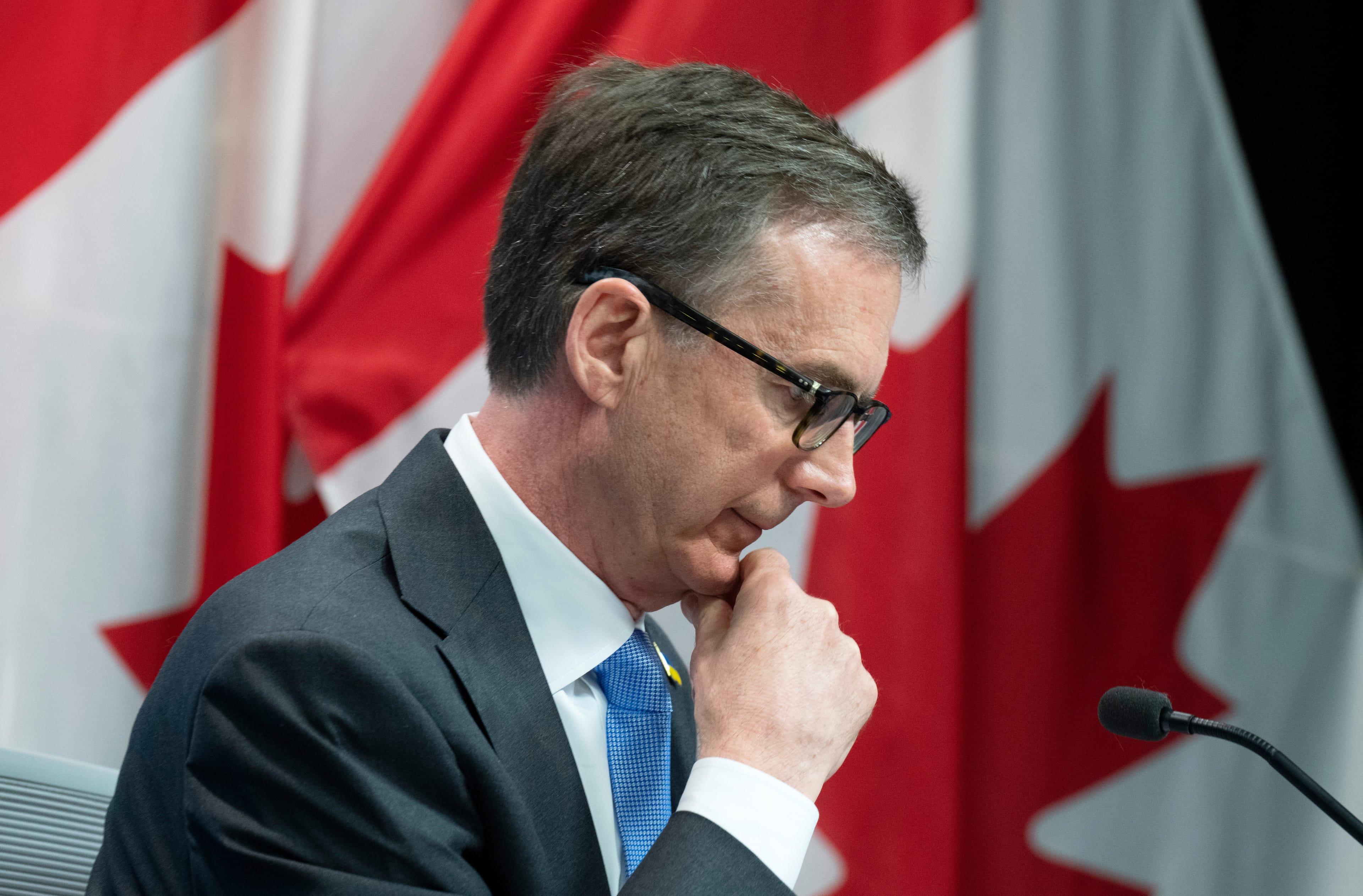 Bank of Canada Governor Tiff Macklem listens to a question from a reporter during a news conference following a rate announcement, April 13, 2022 in Ottawa. (Adrian Wyld/The Canadian Press)