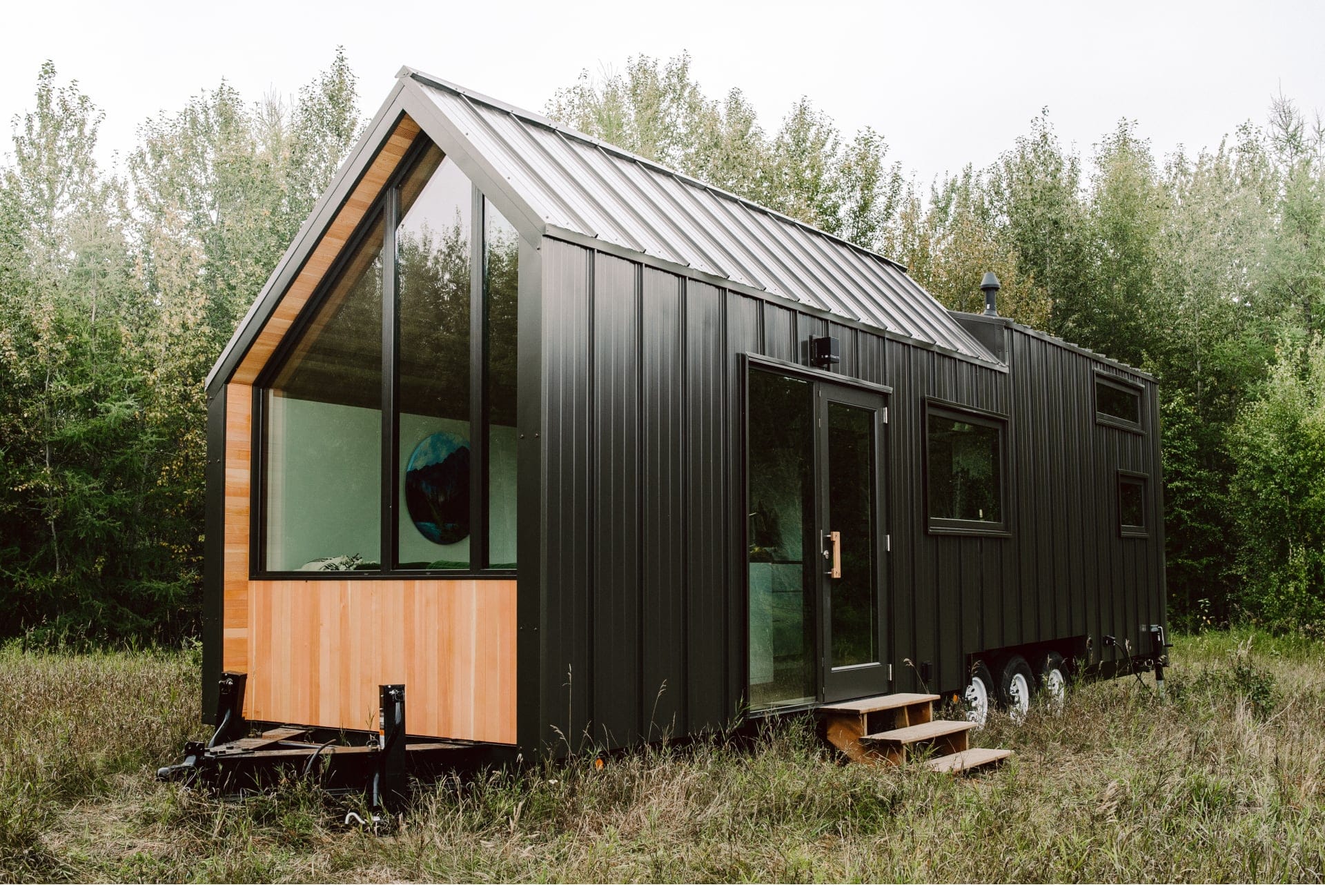 The home’s exterior is covered in countless 16-inch slats of black steel siding (photography courtesy of Anthem Creative)