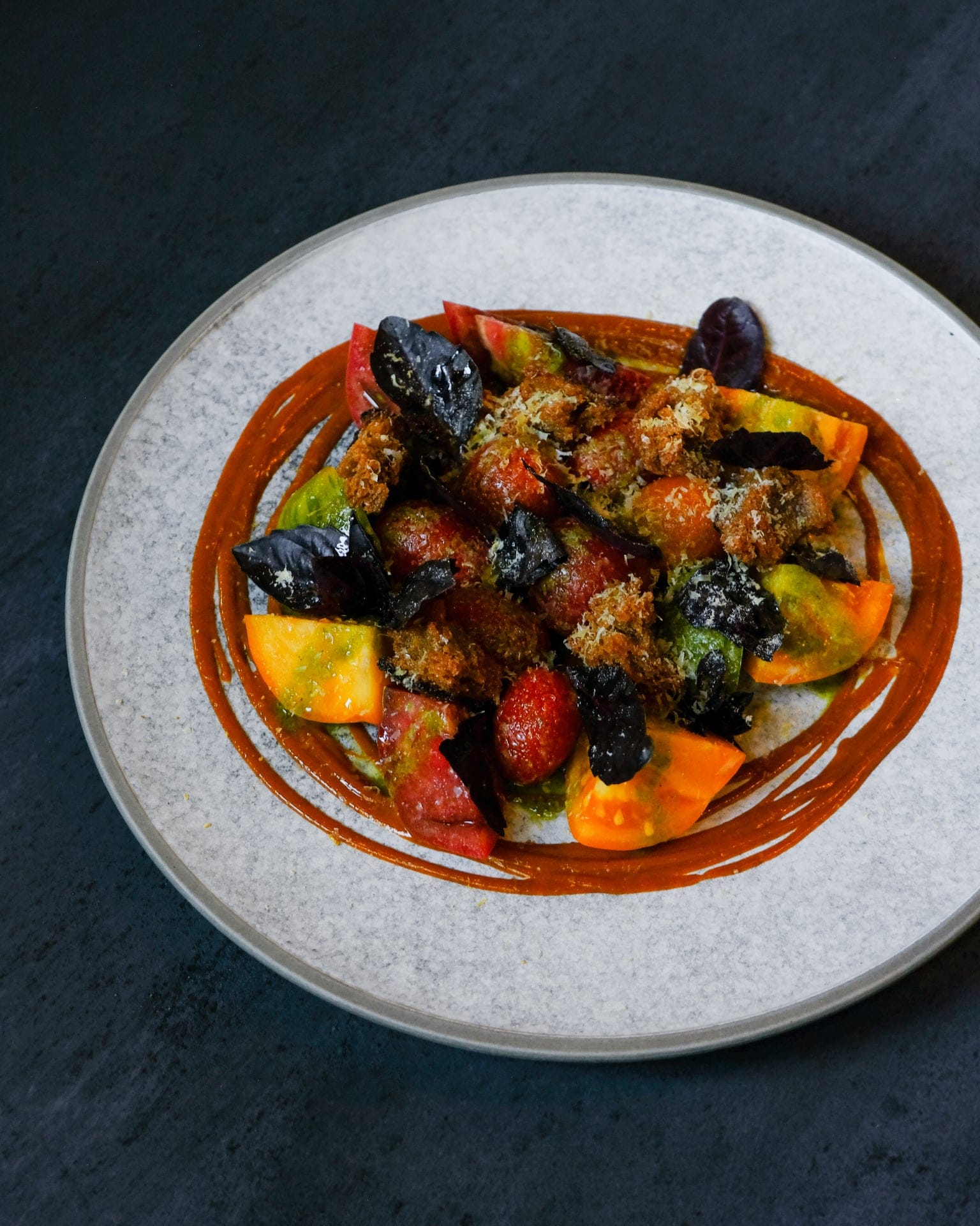 This tomato salad, from the Acorn in Vancouver, is made with compost-ready cast-offs. (Photograph by Lorenzo Ignacio)