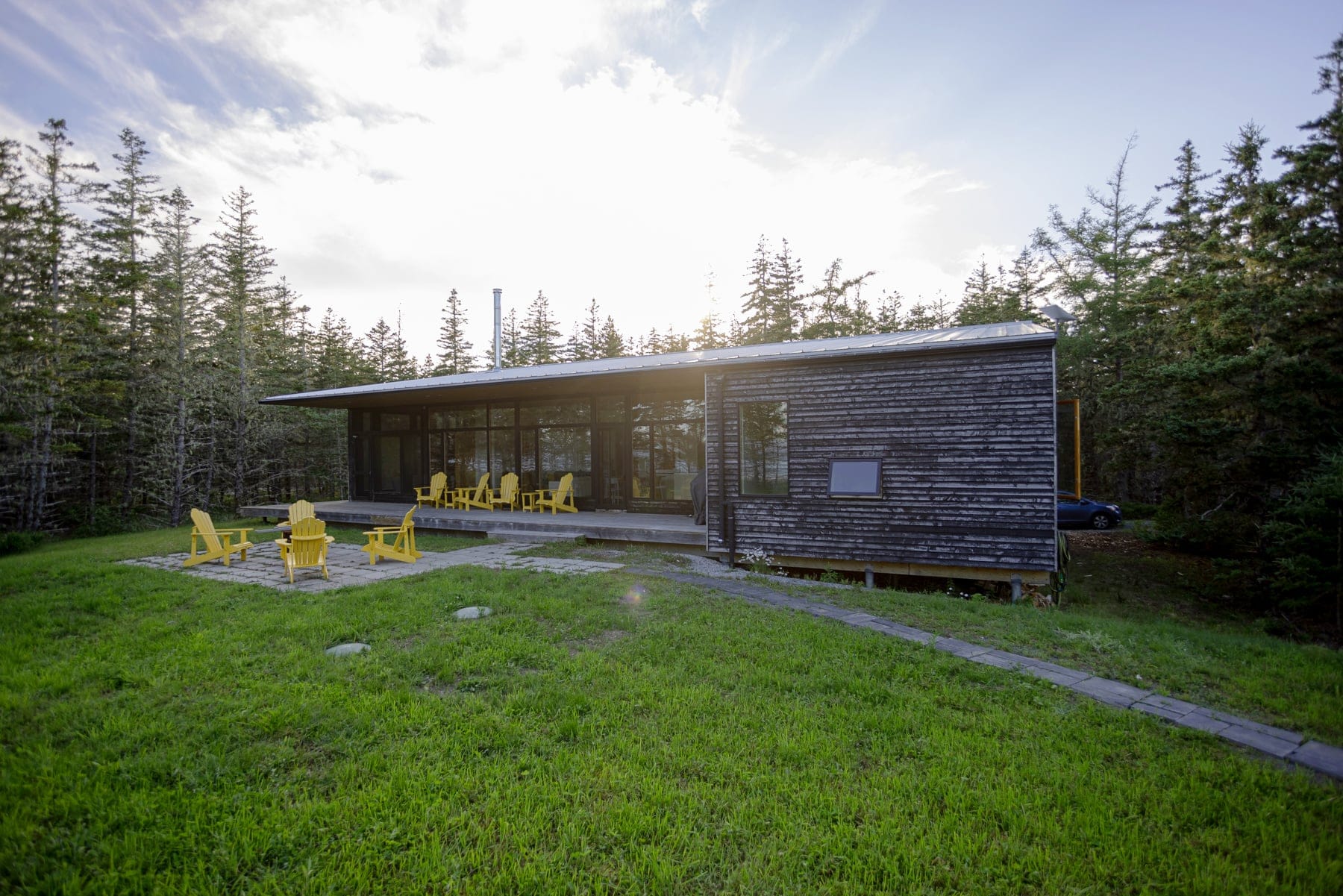 wide angle shot of a rectangular shaped grey home