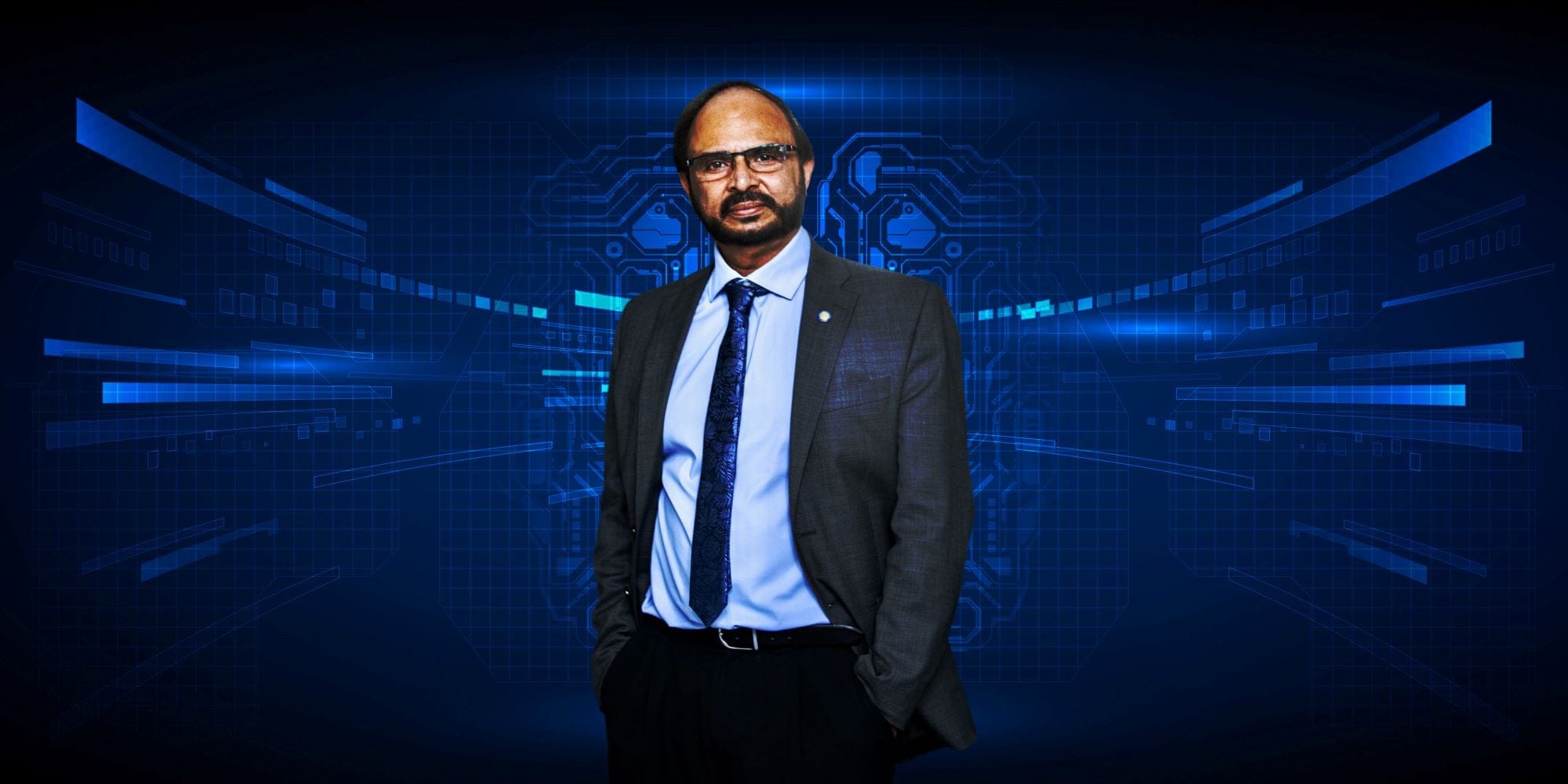 A photo of a Pakistani man in a suit and tie