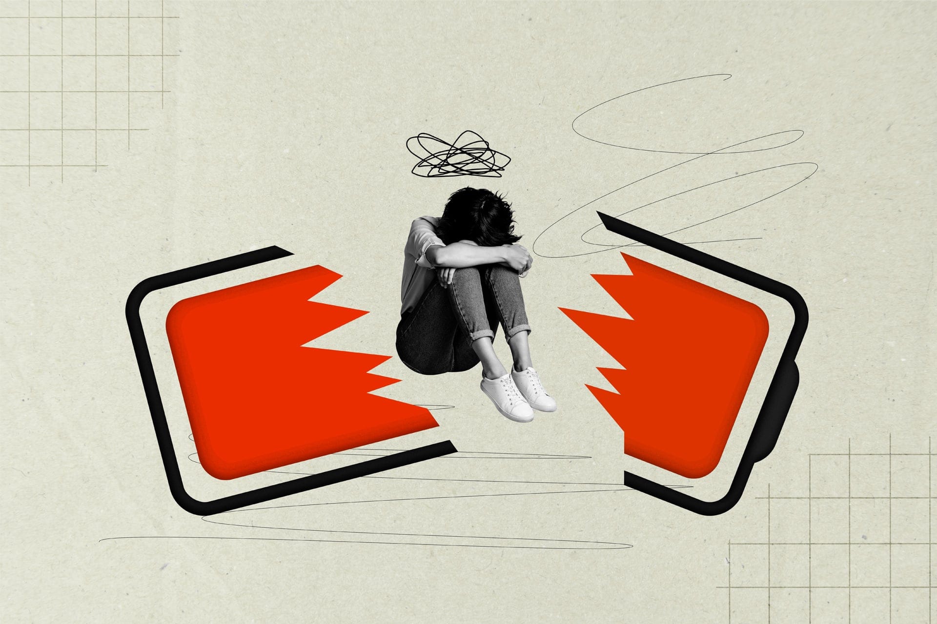 A young woman sitting in despair, with her head down on her knees, in between the shards of a large cartoon mobile phone that's been broken in half