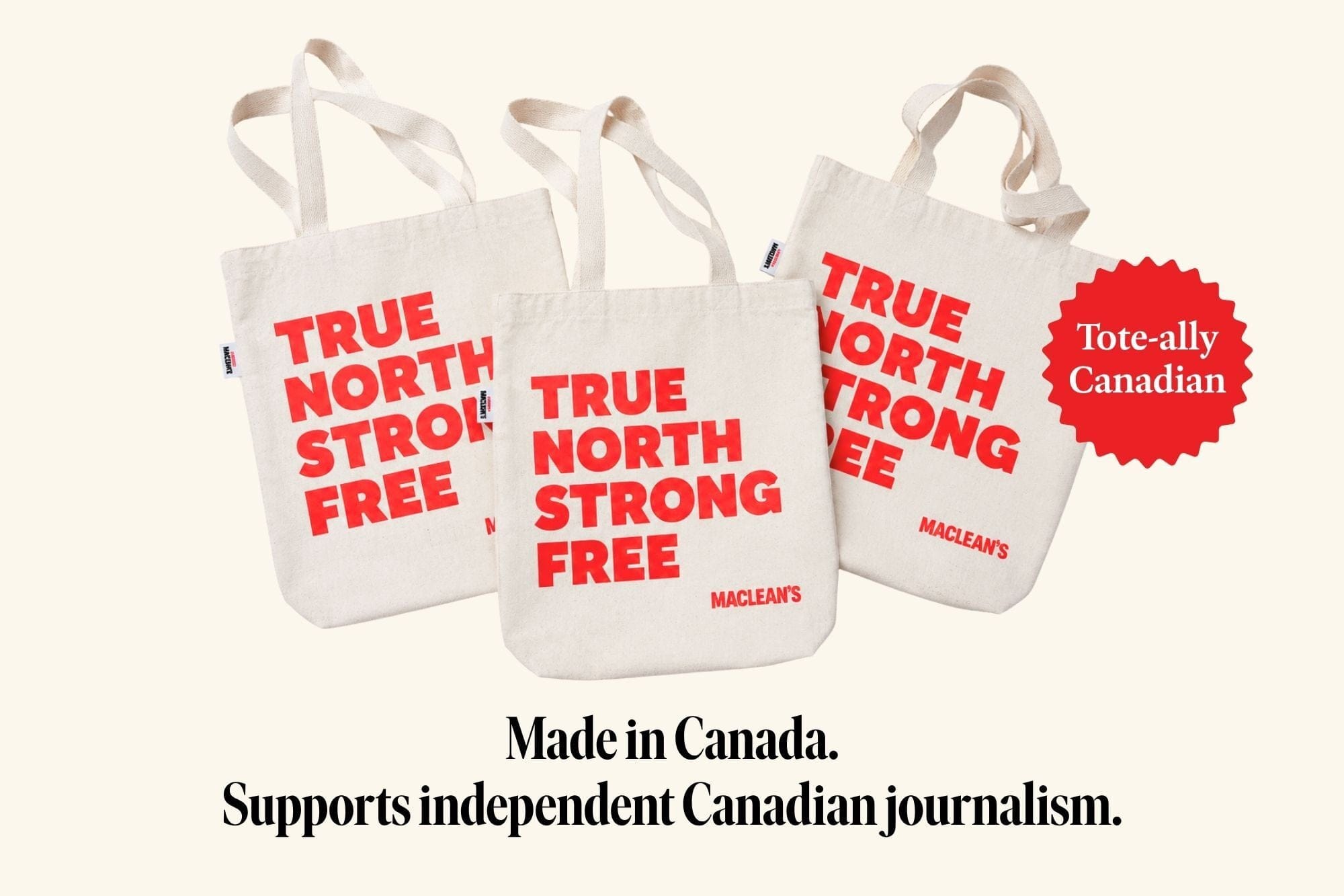 A set of three tote bags that read TRUE NORTH STRONG FREE in red lettering