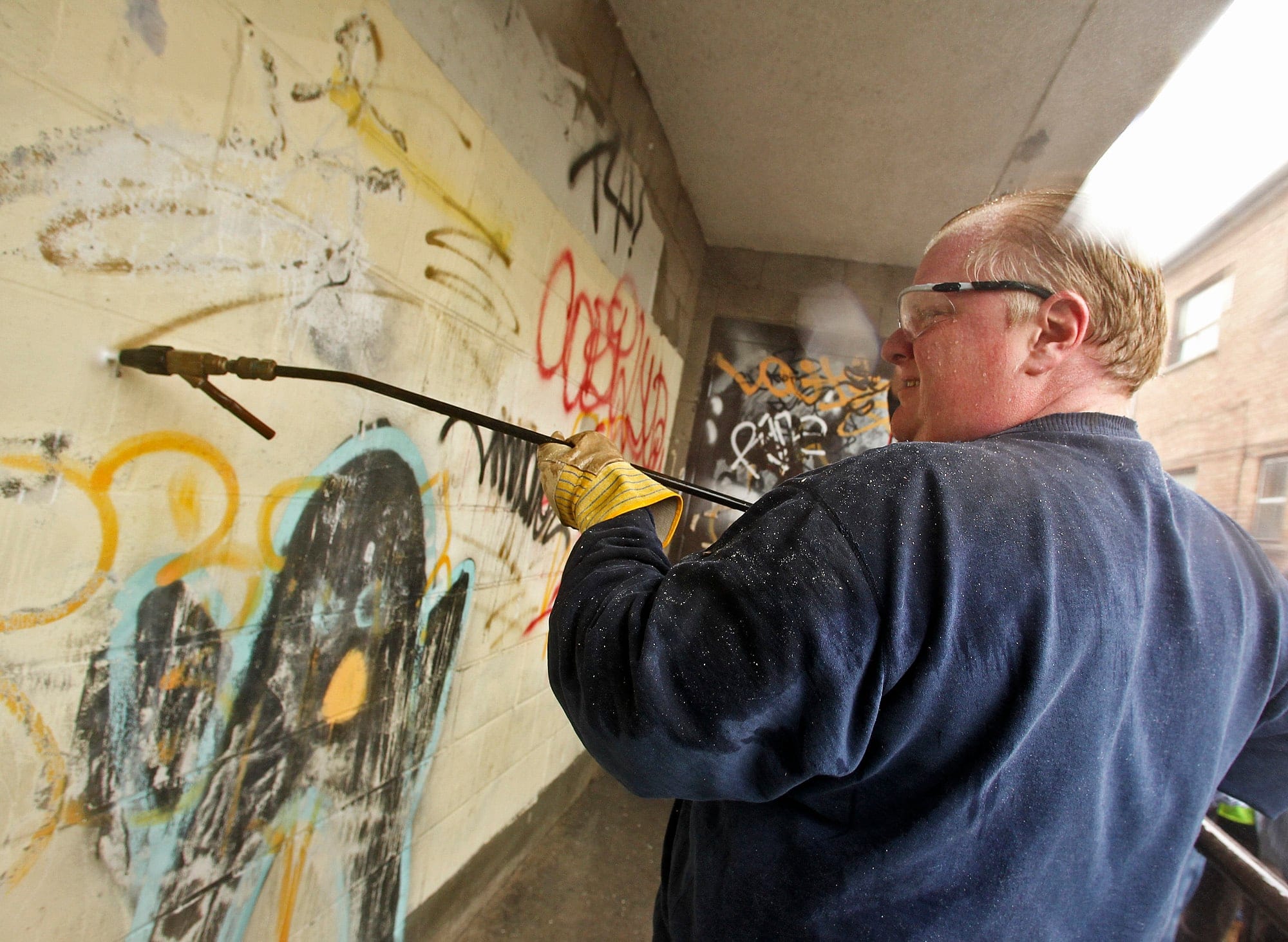 Toronto Mayor Rob Ford attacks graffiti with a power washer. Photo: Tara Walton/Toronto Star