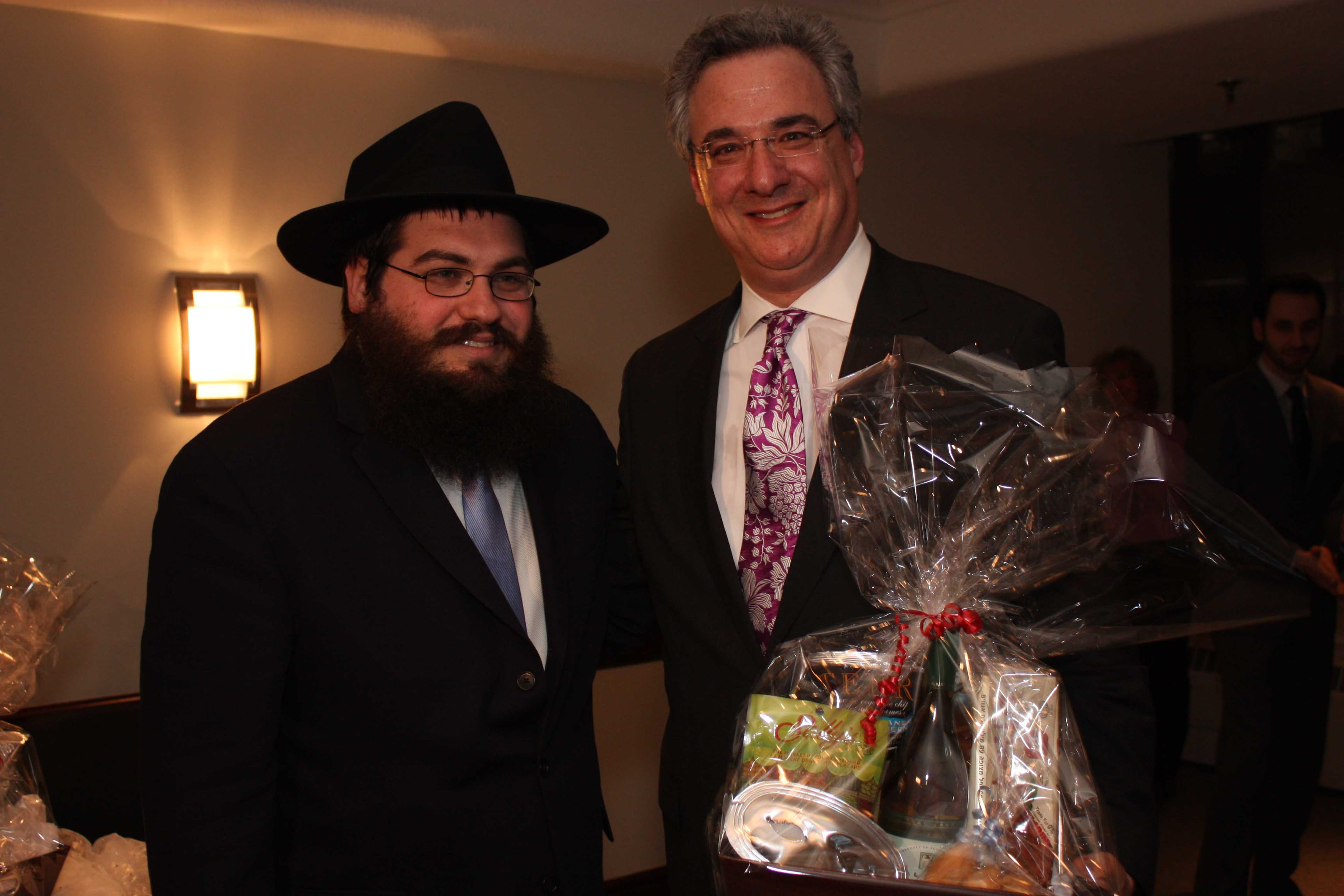 Rabbi Rabbi Chain Mendelsohn (left) Conservative MP Mark Adler