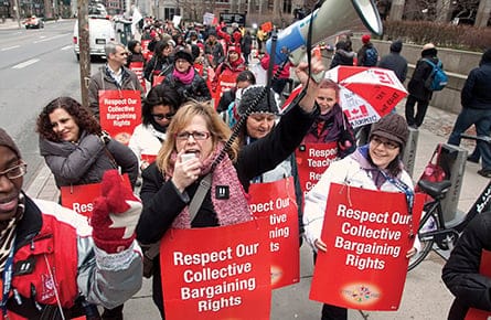 Teachers from Elementary Teachers Federation of Ontario picket outside the provincial Ministry of Education in Toronto.