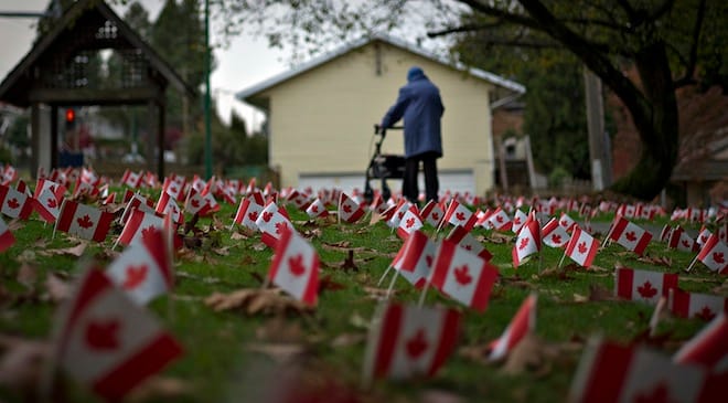 Canadian flags in honour of Remembrance Day cover the property of a seniors home in Burnaby, British Columbia. REUTERS/Andy Clark