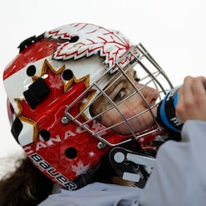Canada's goalie Szabados takes a drink of water during their women's ice hockey team practice ahead of the 2014 Sochi Winter Olympics