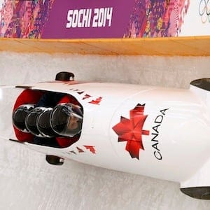 Canada's four-man bobsleigh pilot Rush speeds down the track during an unofficial progressive training at the Sanki sliding center at the Sanki sliding center in Rosa Khutor