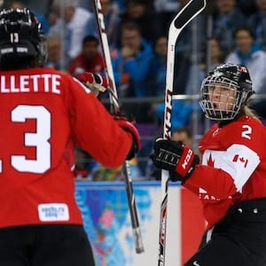 Canada's Agosta-Marciano celebrates her goal against Finland with teammate Ouellette during the third period of their women's ice hockey game at the Sochi 2014 Sochi Winter Olympics
