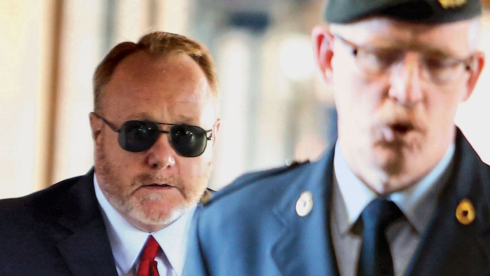 Former military medical technician James Wilks (left), a petty officer second class who is now retired, arrives at a court martial in Gatineau, Que., on Wednesday, Sept. 25, 2013. Wilkes is charged with 11 counts of sexual assault and 18 counts of breach of trust under the National Defence Act. THE CANADIAN PRESS/Fred Chartrand