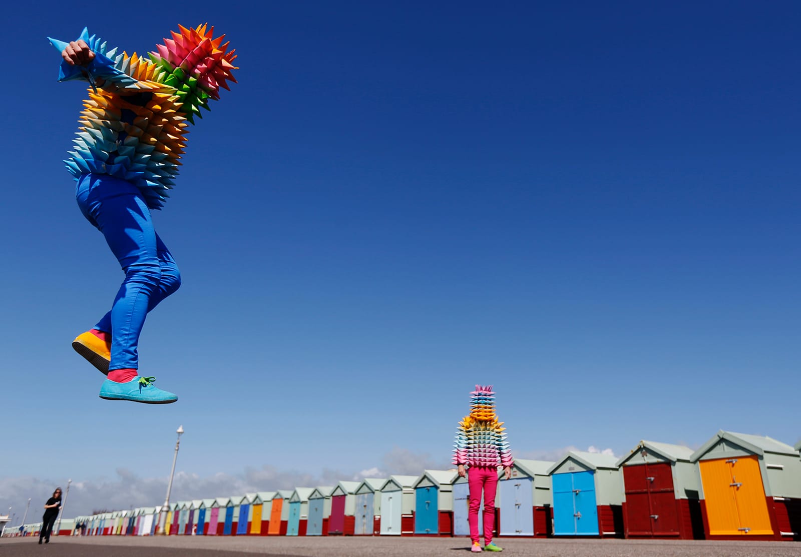 Venezuelan artist Cristobal Ochoa and his performance partner Jean-Paul Fowler promote the Artist Open Houses part of the Brighton Festival with a street art performance, on the seafront in Brighton