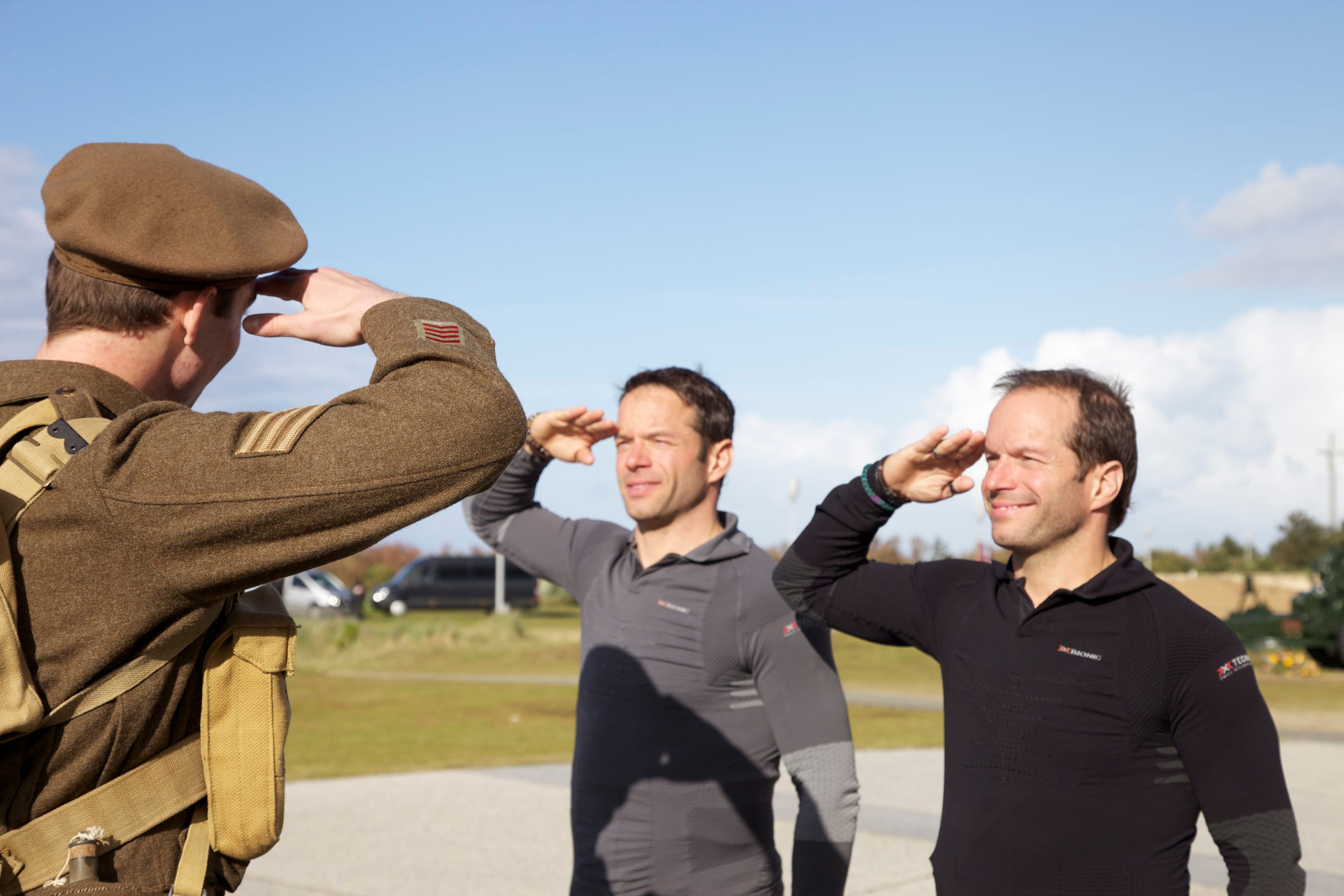 Pierre and Michel salute the soldier at Juno Beach Centre. (Handout/Global)