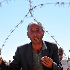 Syrian Kurds Fleeing The Islamic State Militants Cross Into Turkey