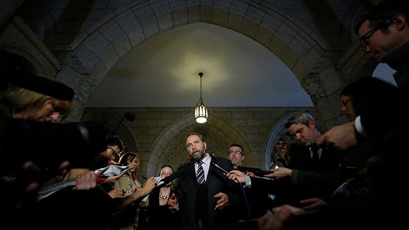 NDP leader Mulcair speaks to journalists in the Senate foyer on Parliament Hill in Ottawa