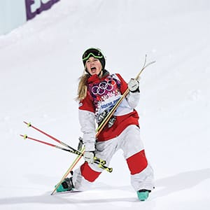 Canada's Justine Dufour-Lapointe celebrates after winning the women's freestyle skiing moguls final competition at the 2014 Sochi Winter Olympic Games in Rosa Khutor