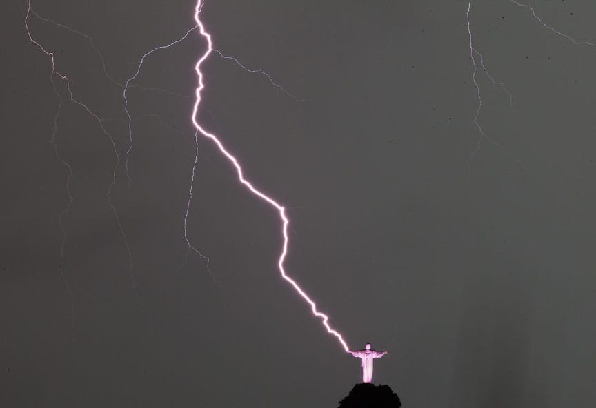 Lightning strikes next to the statue Christ the Redeemer in Rio de Janeiro