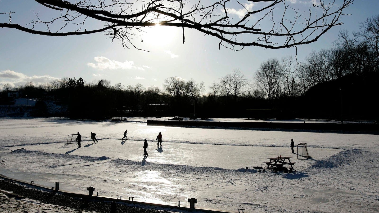 A group of young men play pond hockey on the frozen Kettle Creek in Port Stanley, Ont., Thursday, Feb. 8, 2007.(Dave Chidley/CP)