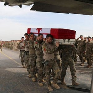 Handout photo of pallbearers from the Canadian Special Operations Regiment carrying the casket of Sergeant Andrew Joseph Doiron during a ramp ceremony in Erbil