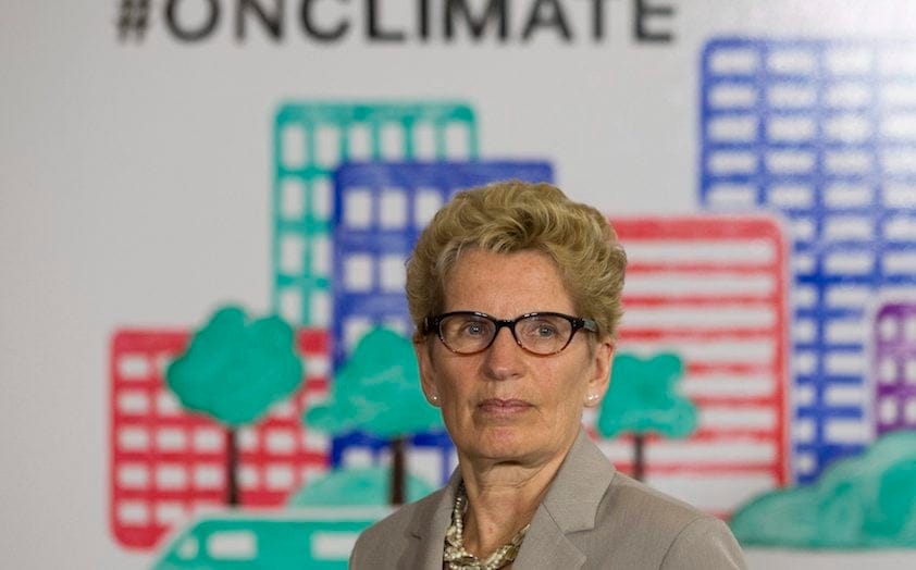 Ontario Premier Kathleen Wynne listens to questions from the media during an announcement which outlined a cap and trade deal with Quebec aimed at curbing green house emissions, in Toronto on Monday, April 13 2015. (Chris Young/CP)