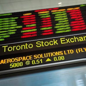 Financial numbers are seen on the digital ticker tape at the TMX Group in Toronto, Ont.'s financial district on Friday, May 9, 2014. THE CANADIAN PRESS/Darren Calabrese