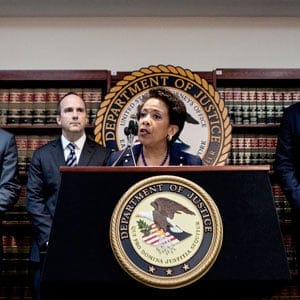 Not-so-beautiful game: U.S. Attorney General Loretta Lynch (centre) announces, from New York, multiple charges against 14 FIFA officials. (Sam Hodgson/The New York Times/Redux)