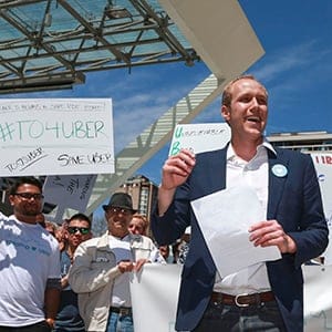 TORONTO, ON - MAY 6: Ian Black, Uber Toronto's general manager, at a lunchtime rally in Nathan Phillips Square, May 6, 2015. (Andrew Francis Wallace/Toronto Star/Getty Images)