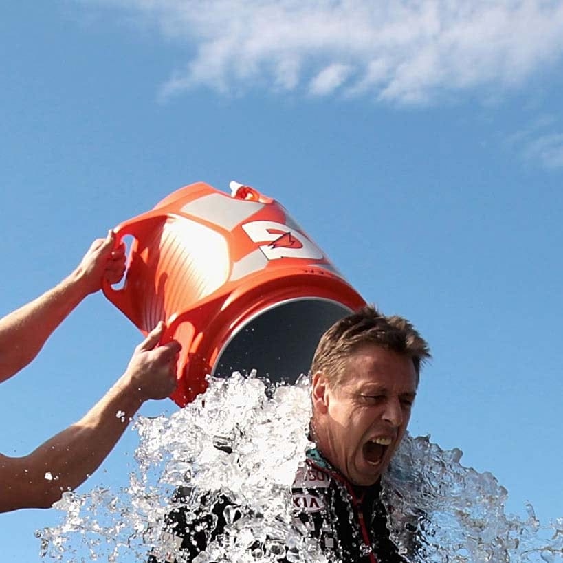 MELBOURNE, AUSTRALIA - AUGUST 22: Coach Mark Thompson undertakes the 'Ice Bucket Challenge' during an Essendon Bombers AFL training session at True Value Solar Centre on August 22, 2014 in Melbourne, Australia. (Photo by Robert Prezioso/Getty Images)