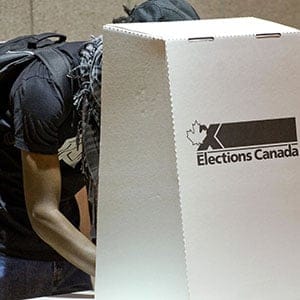 A Canadian prepares his ballot at a polling center October 14, 2008 in St. Laurent, Quebec. Canada is the first major economy to go to the polls since the start of a global financial meltdown, to be followed by a US presidential election November 4. Rogerio Barbosa/AFP/Getty Images