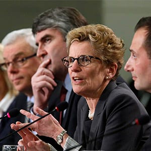 Ontario Premier Kathleen Wynne (2nd R) speaks during a news conference following a meeting of provincial and territorial premiers in Ottawa January 30, 2015. (Chris Wattie/Reuters)