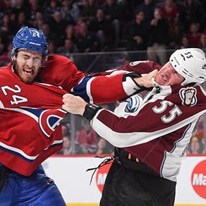 Jarred Tinordi #24 of the Montreal Canadiens fights with Cody McLeod #55 of the Colorado Avalanche in the NHL game at the Bell Centre on October 18, 2014 in Montreal, Quebec, Canada. (Francois Lacasse/NHLI/Getty Images)