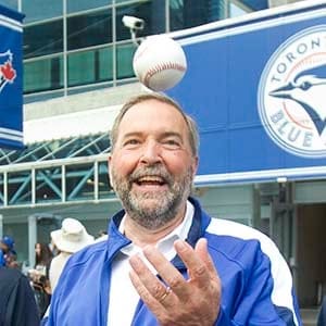 NDP leader Tom Mulcair arrives at Toronto Blue Jays game with his sons Matt and Greg prior to the start of AL baseball game against the New York Yankees in Toronto on Friday August 14, 2015. (Fred Thornhill/CP)