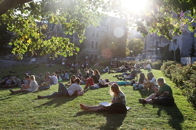 Students relax on the lawn next to a football field on the McGill University Campus. This part of the campus is known as "the beach" because of its exposure to the sun.
Photograph by Roger Lemoyne