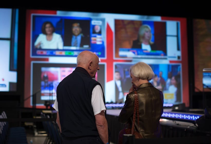 Conservative Party supporters watch early federal election results on television feeds at the party's election night headquarters in Calgary, Alta., on Monday October 19, 2015. THE CANADIAN PRESS/Darryl Dyck