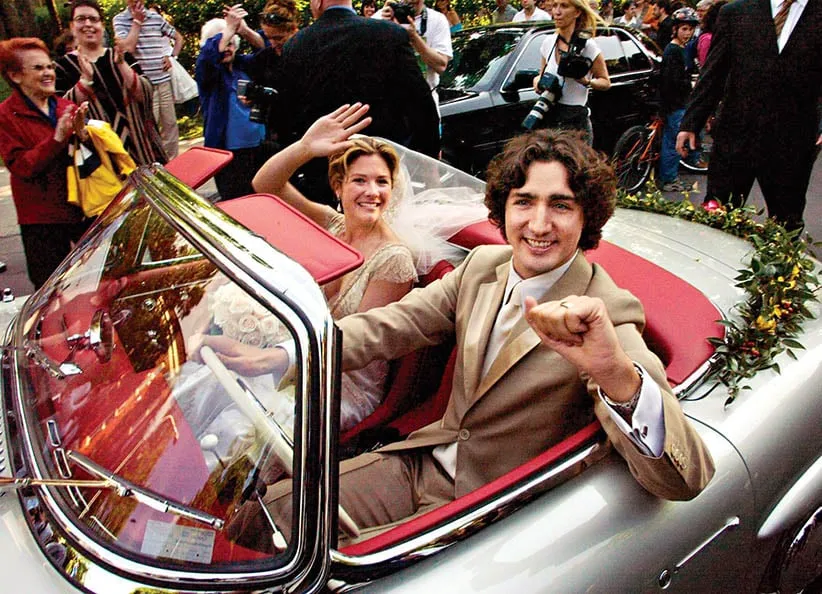 FOR USE AS DESIRED WITH DECADE END STORIES OR AS A STAND-ALONE PHOTO PACKAGE FILE - Justin Trudeau, son of the late Prime Minister Pierre Trudeau, leaves with his new bride Sophie Gregoire in his father's 1959 Mercedes 300 SEL after their marriage ceremony in Montreal Saturday, May 28, 2005.(RYAN REMIORZ/CP)