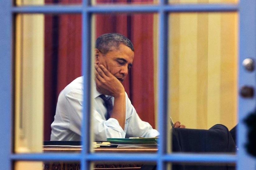 President Barack Obama works at his desk in the Oval Office of the White House in Washington, Monday, Jan. 27, 2014, ahead of Tuesday night's State of the Union speech. Obama's address will likely turn to emphasis on executive powers he can use to get things done without a gridlocked Congress, dropping last year's focus on a sweeping legislative agenda. (AP Photo/Jacquelyn Martin)