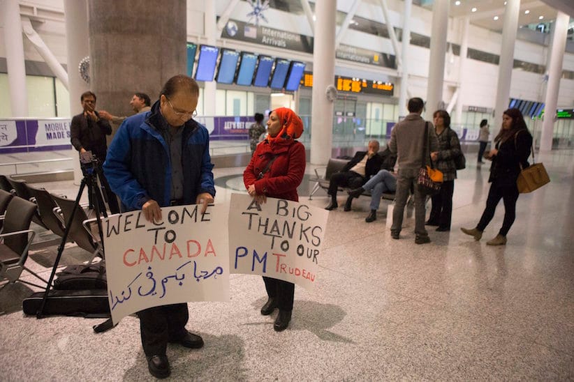 Well-wishers gather in the hope of greeting Syrian refugees arriving on the first government arranged flight at Toronto's Pearson Airport, on Thursday, Dec. 10, 2015. (Chris Young/CP)