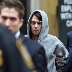 NEW YORK, NY - DECEMBER 17: Martin Shkreli (C), CEO of Turing Pharmaceutical, is brought out of 26 Federal Plaza by law enforcement officials after being arrested for securities fraud on December 17, 2015 in New York City. Shkreli gained notoriety earlier this year for raising the price of Daraprim, a medicine used to treat the parasitic condition of toxoplasmosis, from $13.50 to $750 though the arrest that happened early this morning does not involve that price hike. Andrew Burton/Getty Images