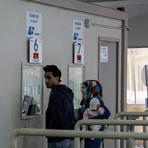 Syrian refugees wait to at a UNHCR reception center in Beirut, Lebanon, on Dec 2, 2015. Here refugees are able to access a range of information and services from UNHCR, including resettlement to foreign countries. (Photograph by Sam Tarling)