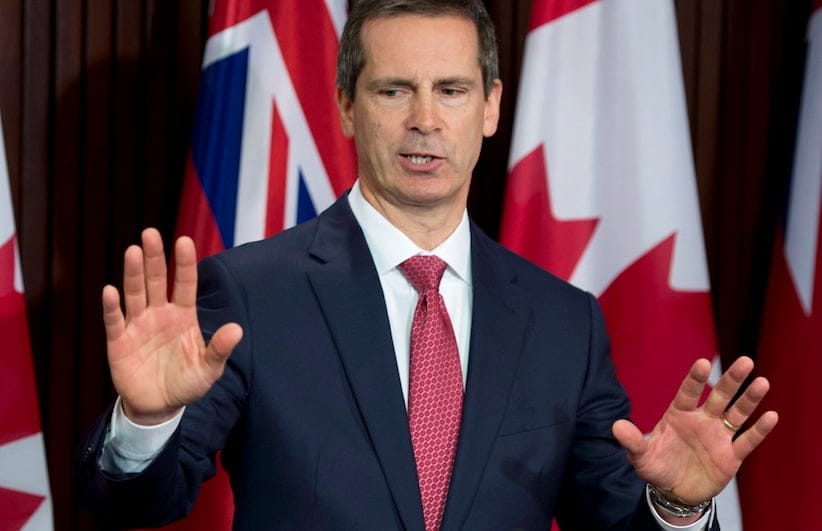Former Ontario premier Dalton McGuinty answers media questions after appearing before the Special Committee on Justice Policy at the Ontario Legislature in Toronto on Tuesday May 7, 2012. THE CANADIAN PRESS/Frank Gunn