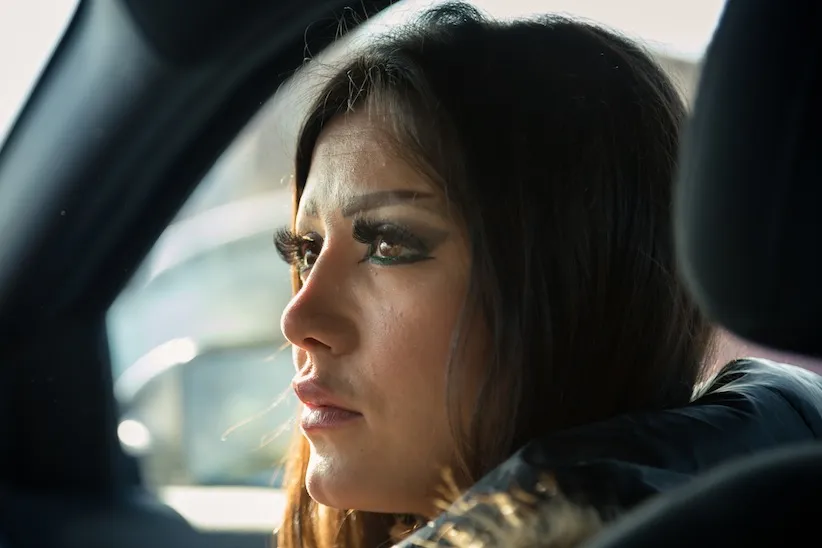 Stopped at a red light, Rasha looks to her fiancé Arturo from the passenger seat of his car. Rasha says she loves to go for long drives, often without any destination in mind.
